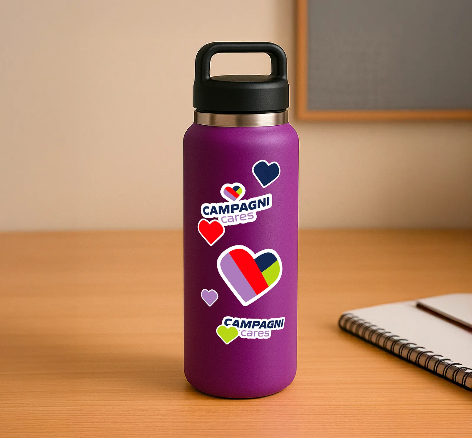 Image of a purple water bottle with stickers of the Campagni Cares logo on it