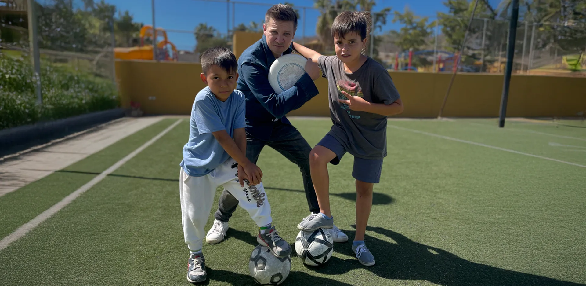 Jeremey Renner playing sports with kids for the Rennervation Foundation