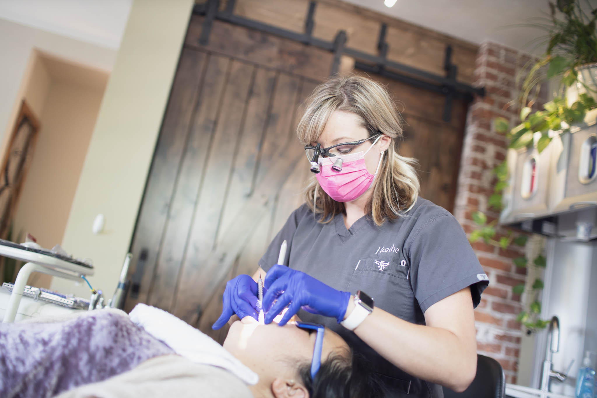 Editorial photo of dental professional working with a patient at a practice