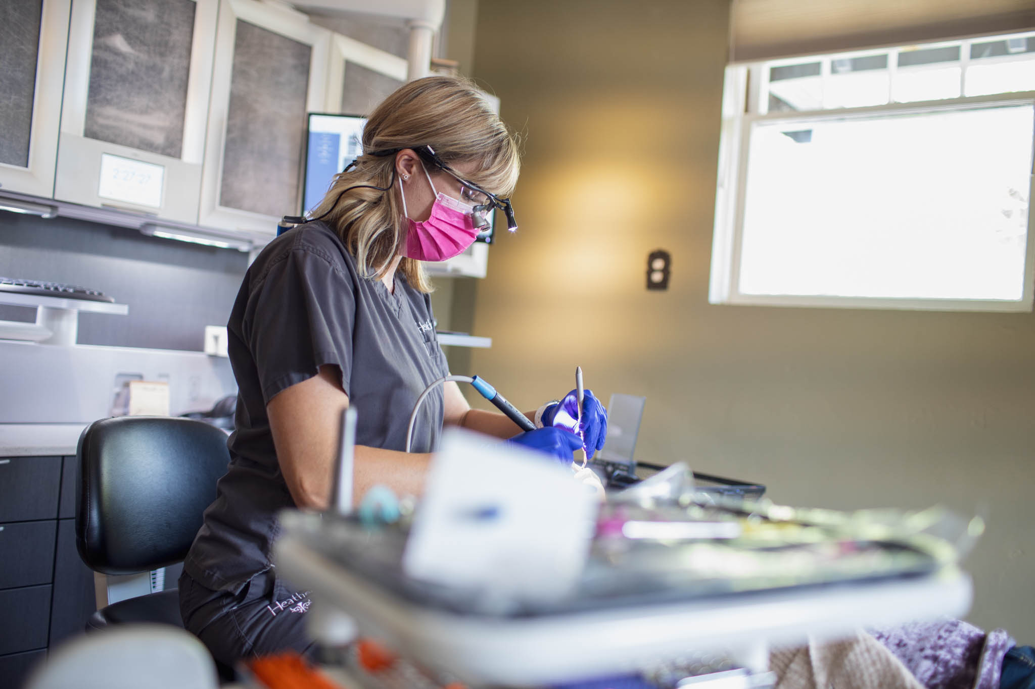 Editorial portrait of a dental hygienist working