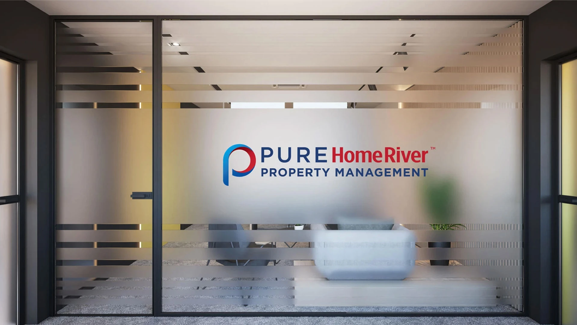 Interior office window looking into a conference room with a PURE Home River window decal